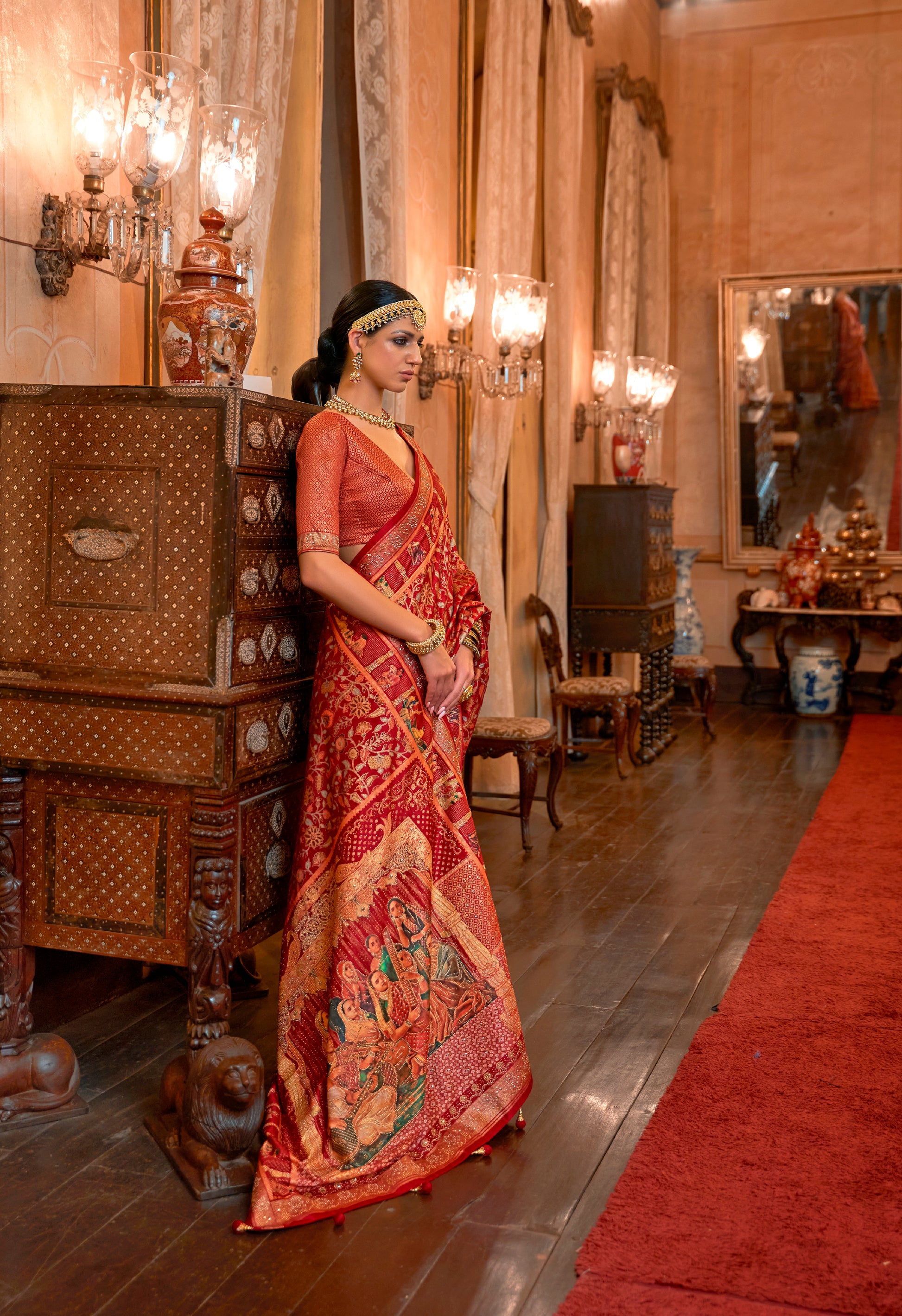 Red Patola Silk Saree with Traditional Motifs and Handmade Tassels