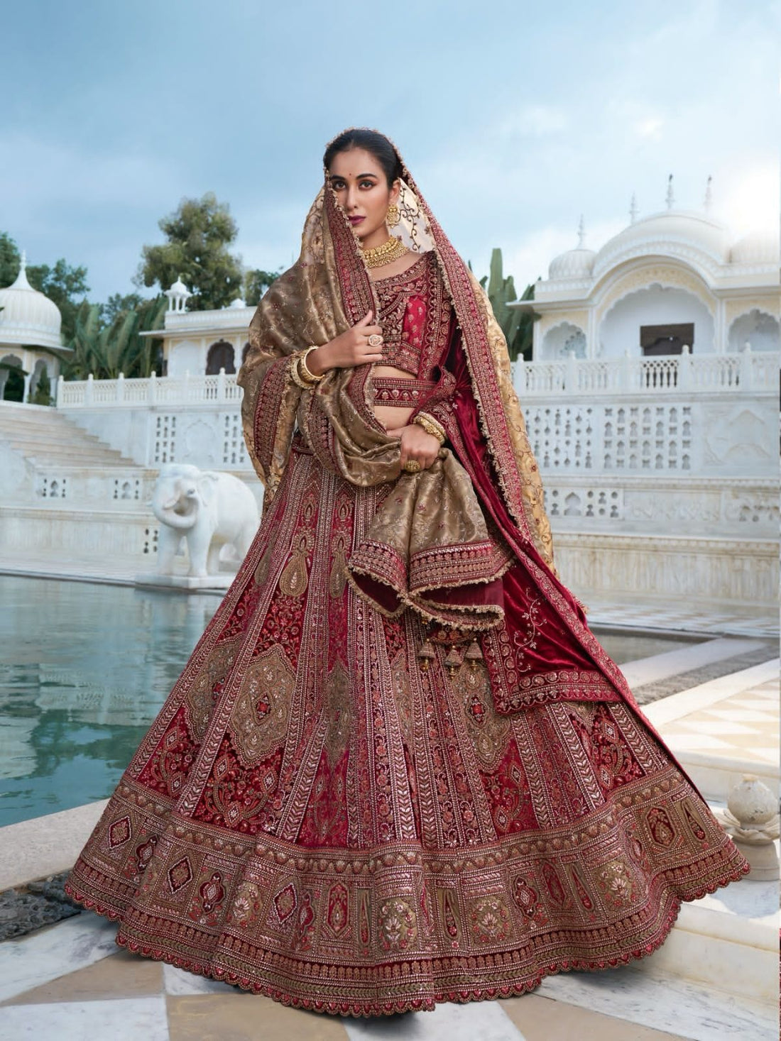 Maroon and Gold Bridal Lehenga with Handcrafted Embroidery