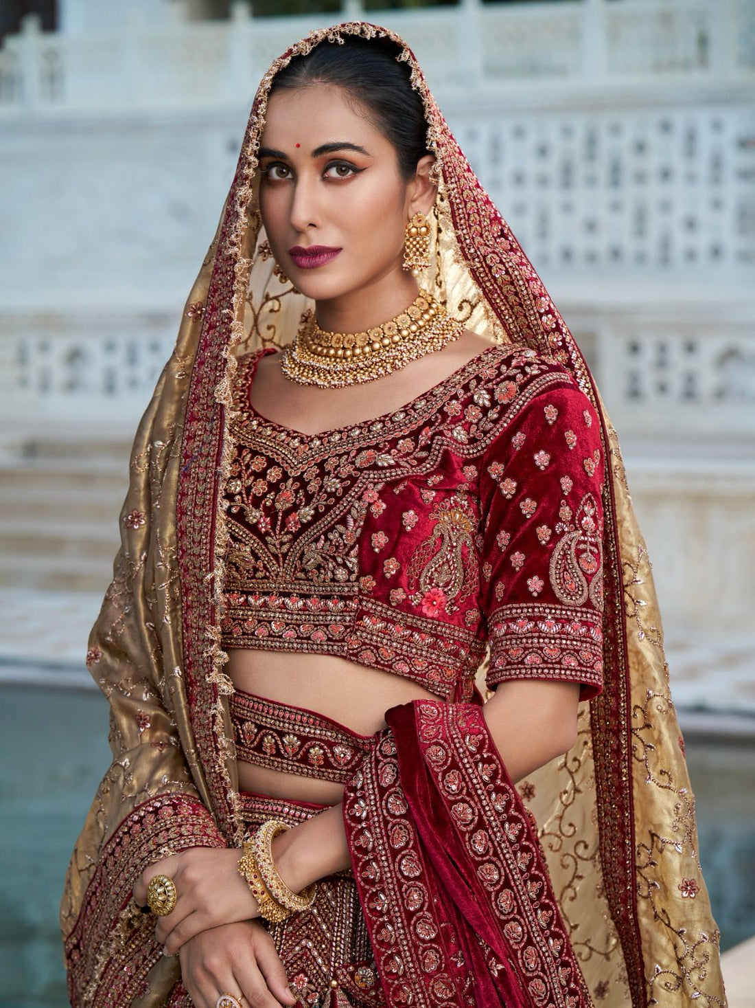 Maroon and Gold Bridal Lehenga with Handcrafted Embroidery