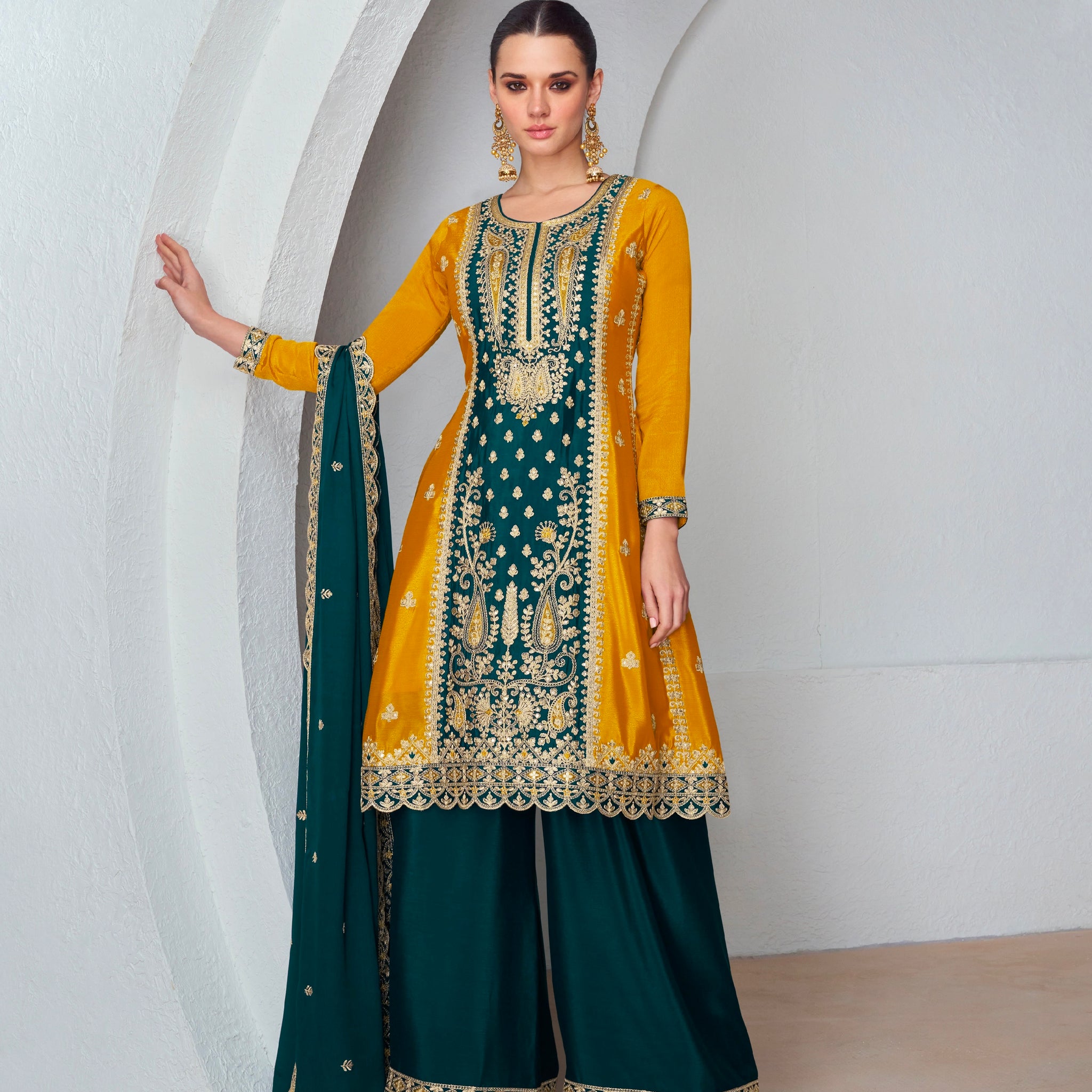 Woman in Mustard Yellow and Dark Green Embroidered Palazzo Suit.