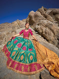 Woman in teal and pink Banarasi silk lehenga with embroidered blouse and yellow georgette dupatta.