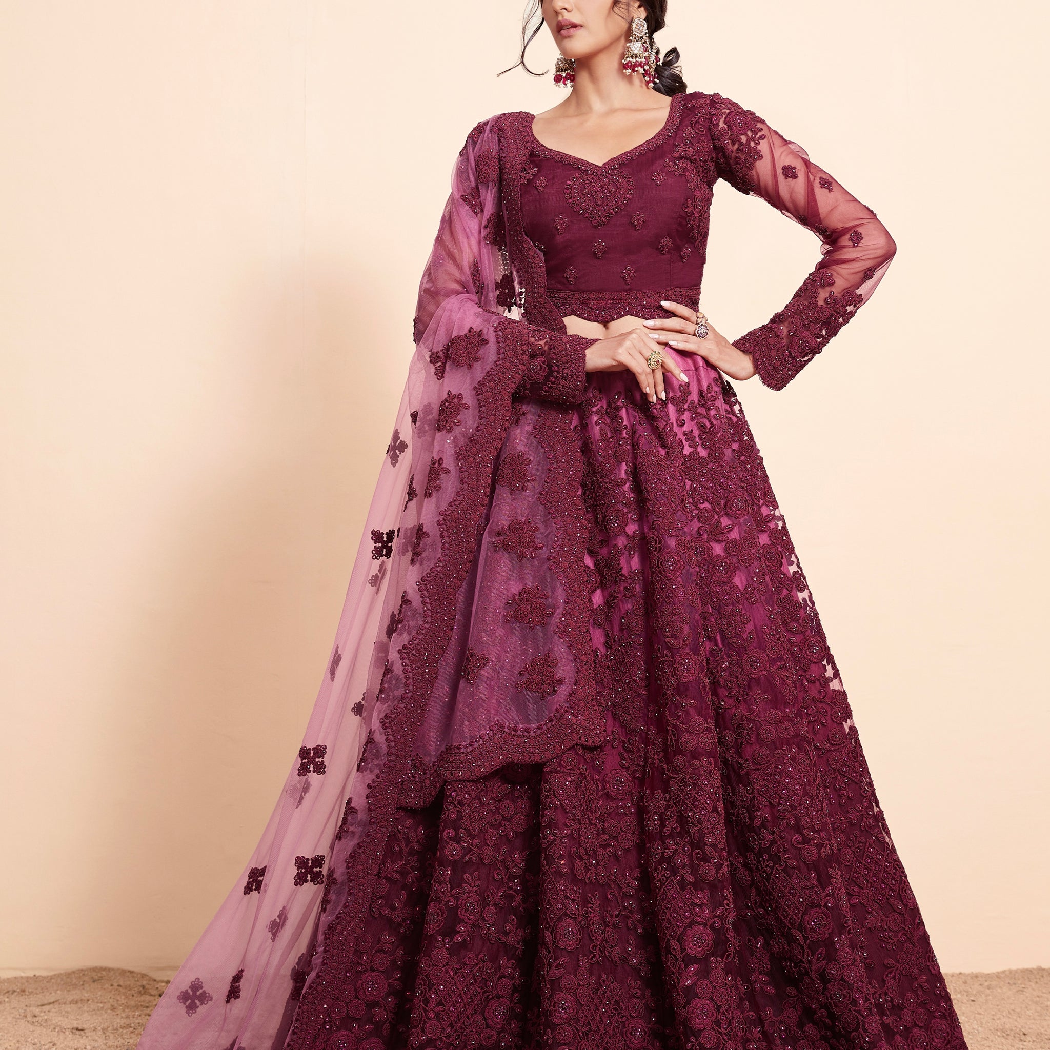 Rich Wine Net Lehenga Choli Set with Heavy Stone Work Embellishment