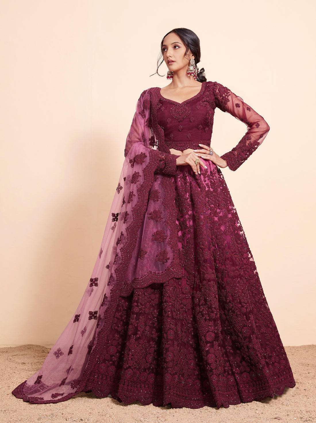 Rich Wine Net Lehenga Choli Set with Heavy Stone Work Embellishment