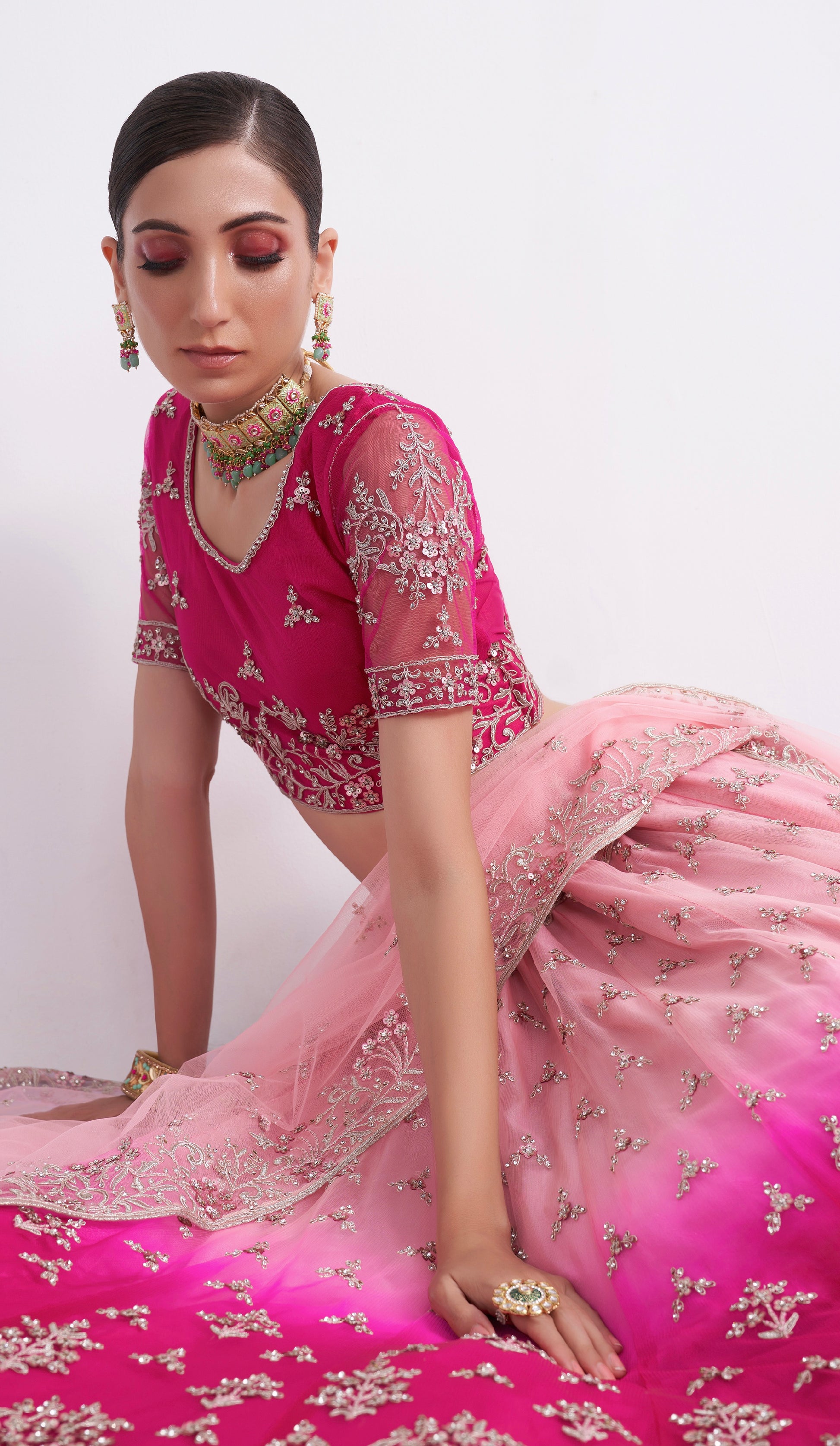 Elegant shaded pink net blouse & lehenga set with silk inner and net dupatta.