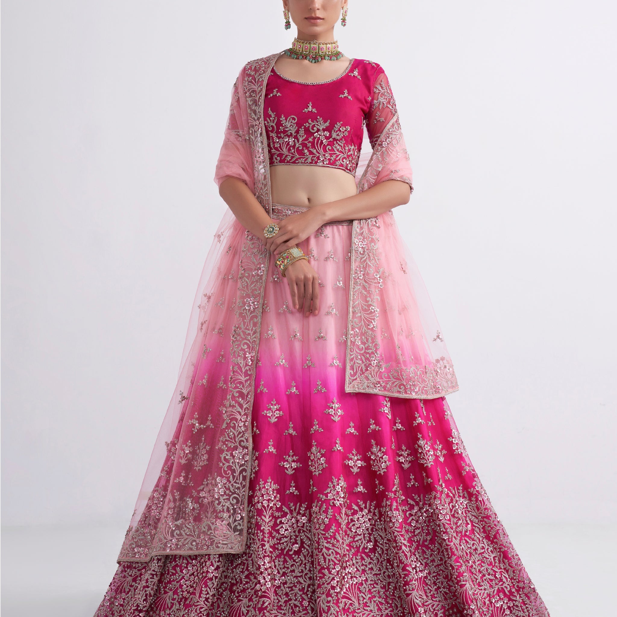 Elegant shaded pink net blouse & lehenga set with silk inner and net dupatta.