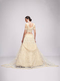 Elegant off-white net lehenga with intricate embroidery and stone embellishments.