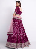 Stunning magenta bridal lehenga with heavy embroidery.