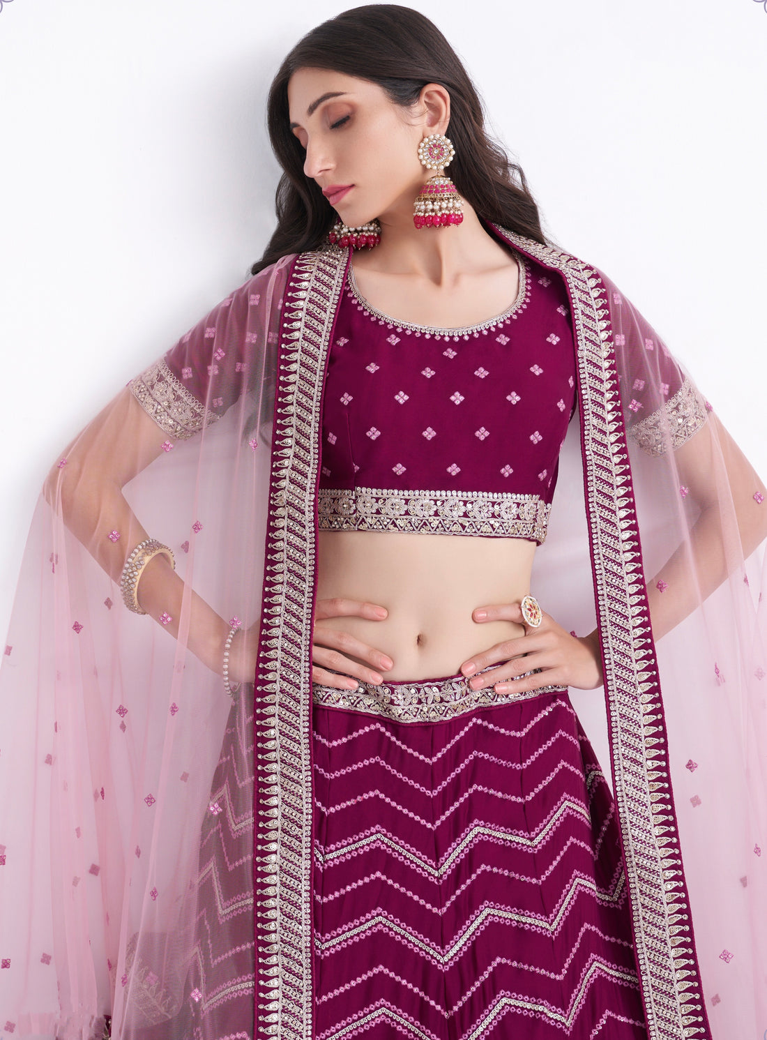 Stunning magenta bridal lehenga with heavy embroidery.