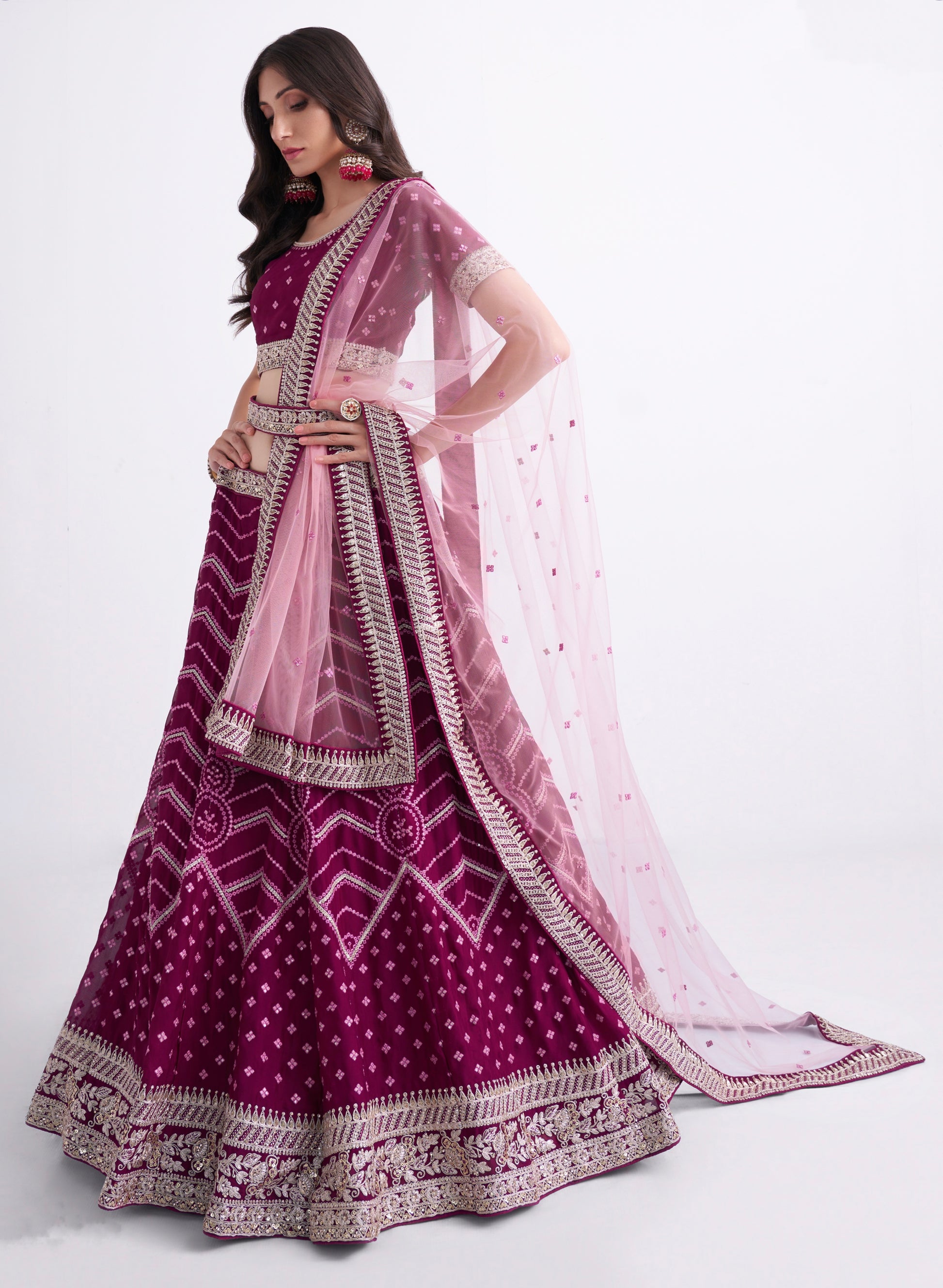 Stunning magenta bridal lehenga with heavy embroidery.