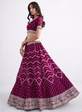 Stunning magenta bridal lehenga with heavy embroidery.