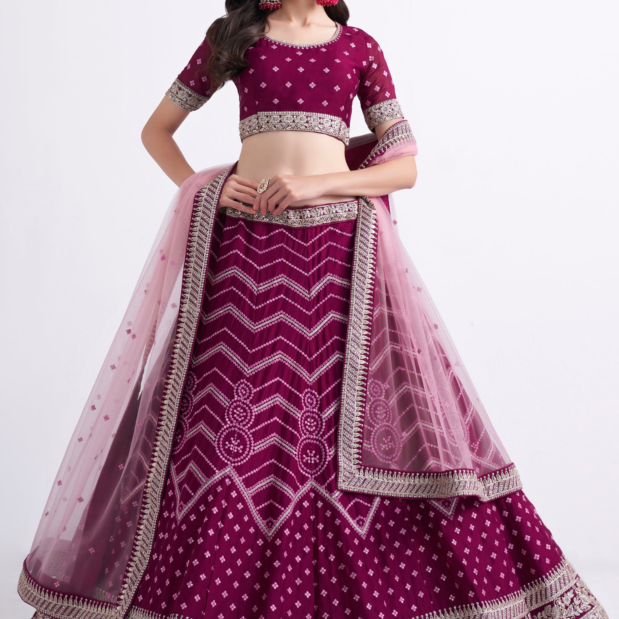 Stunning magenta bridal lehenga with heavy embroidery.