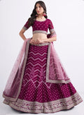 Stunning magenta bridal lehenga with heavy embroidery.