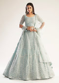 Elegant pastel ocean blue bridal lehenga with ribbon gota work and heavy zarkan embellishments.