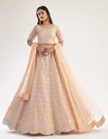 Elegant peach bridal lehenga with ribbon gota work and heavy zarkan embellishments.