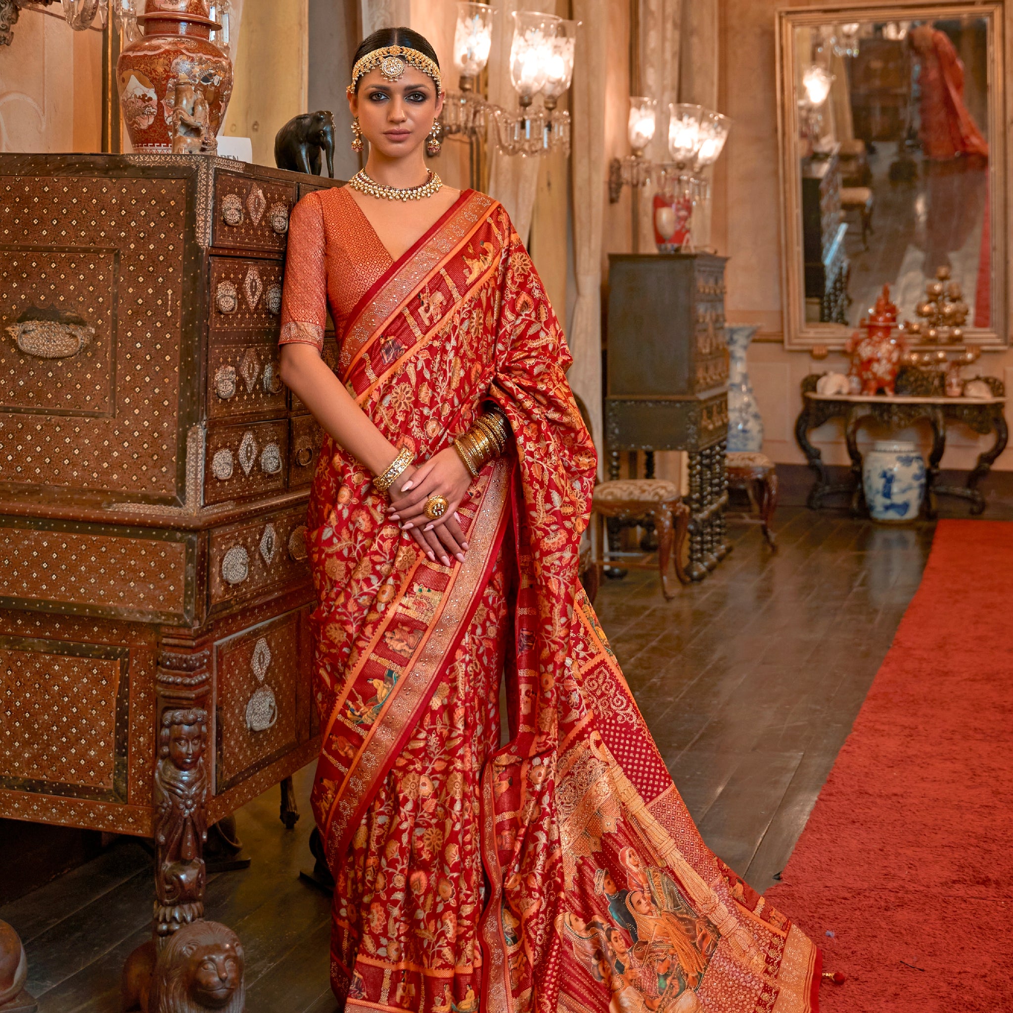 Red Patola Silk Saree with Traditional Motifs and Handmade Tassels