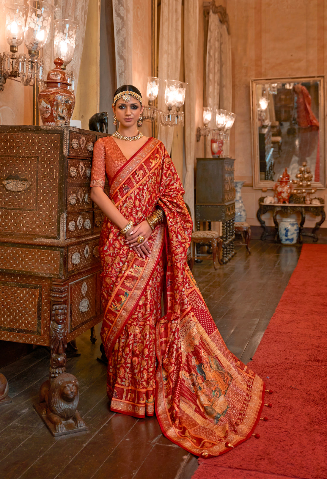 Red Patola Silk Saree with Traditional Motifs and Handmade Tassels