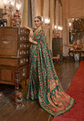 Green Patola Silk Saree with Traditional Motifs and Handmade Tassels