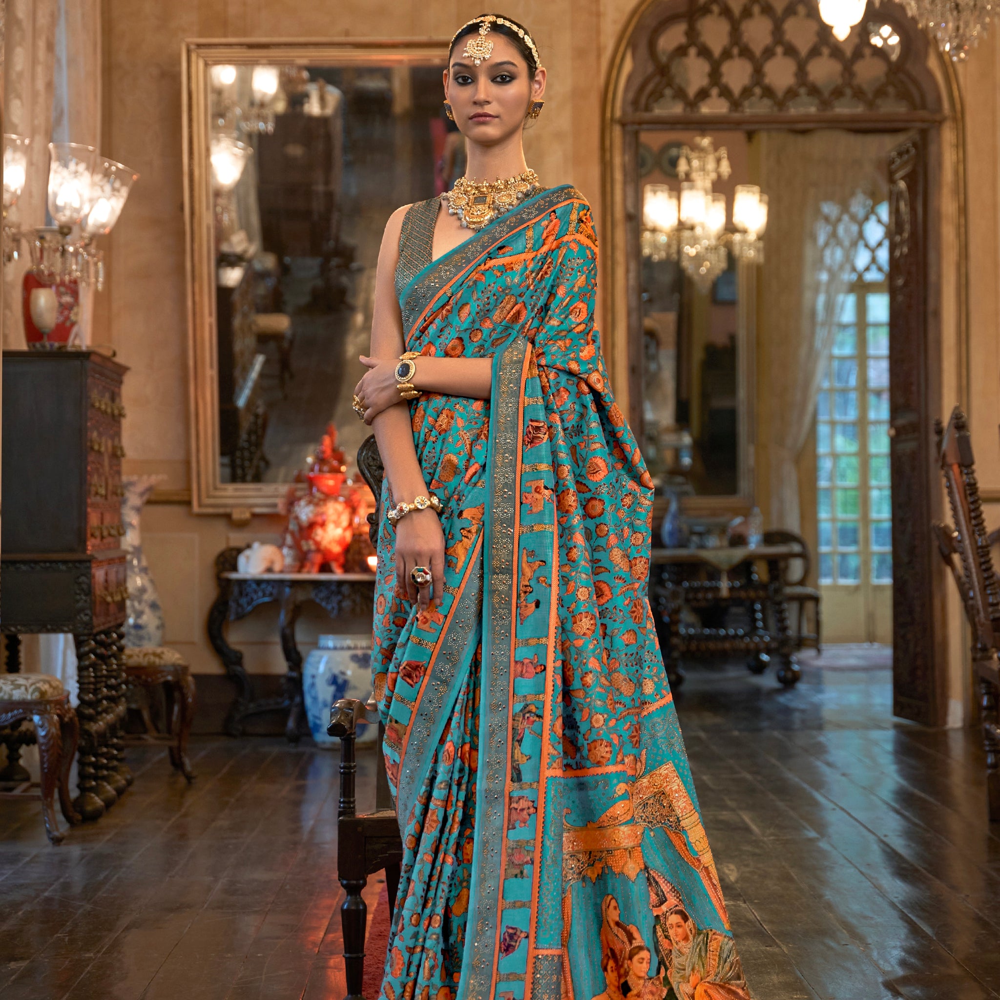 Turquoise Patola Silk Saree with Traditional Motifs and Handmade Tassels