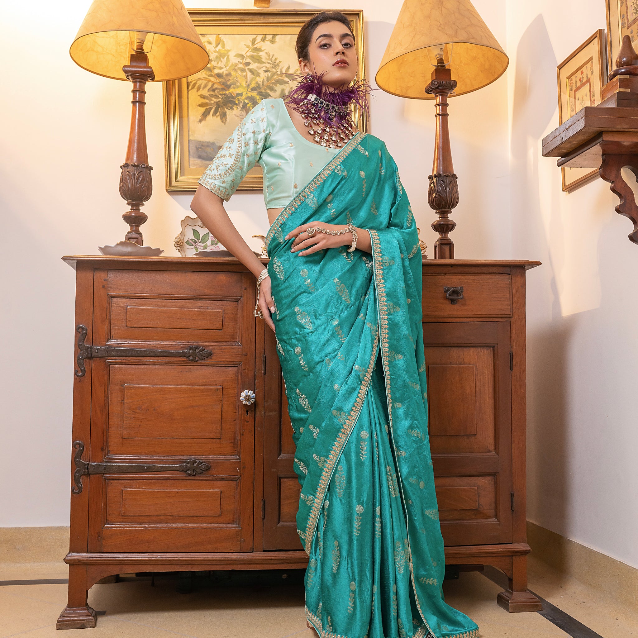 Turquoise Viscose Satin Silk Saree with Zari Motifs and Sequin Embroidery