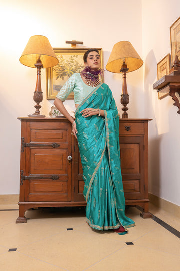 Turquoise Viscose Satin Silk Saree with Zari Motifs and Sequin Embroidery