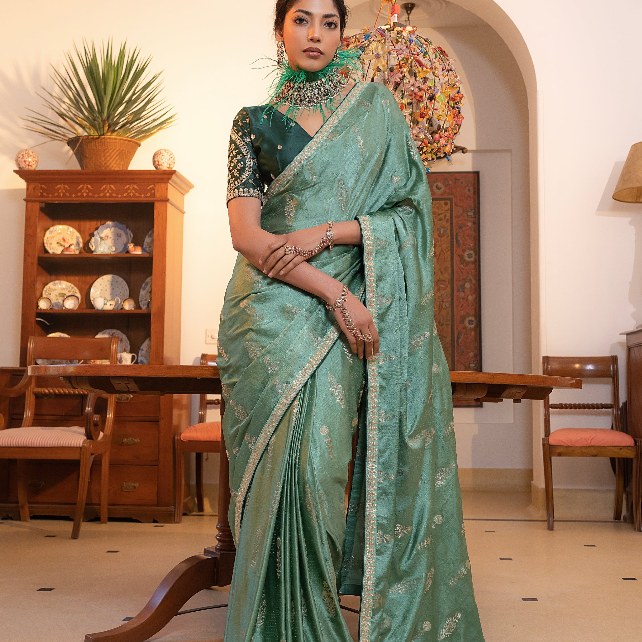 Sea Green Viscose Satin Silk Saree with Zari Motifs and Sequin Embroidery