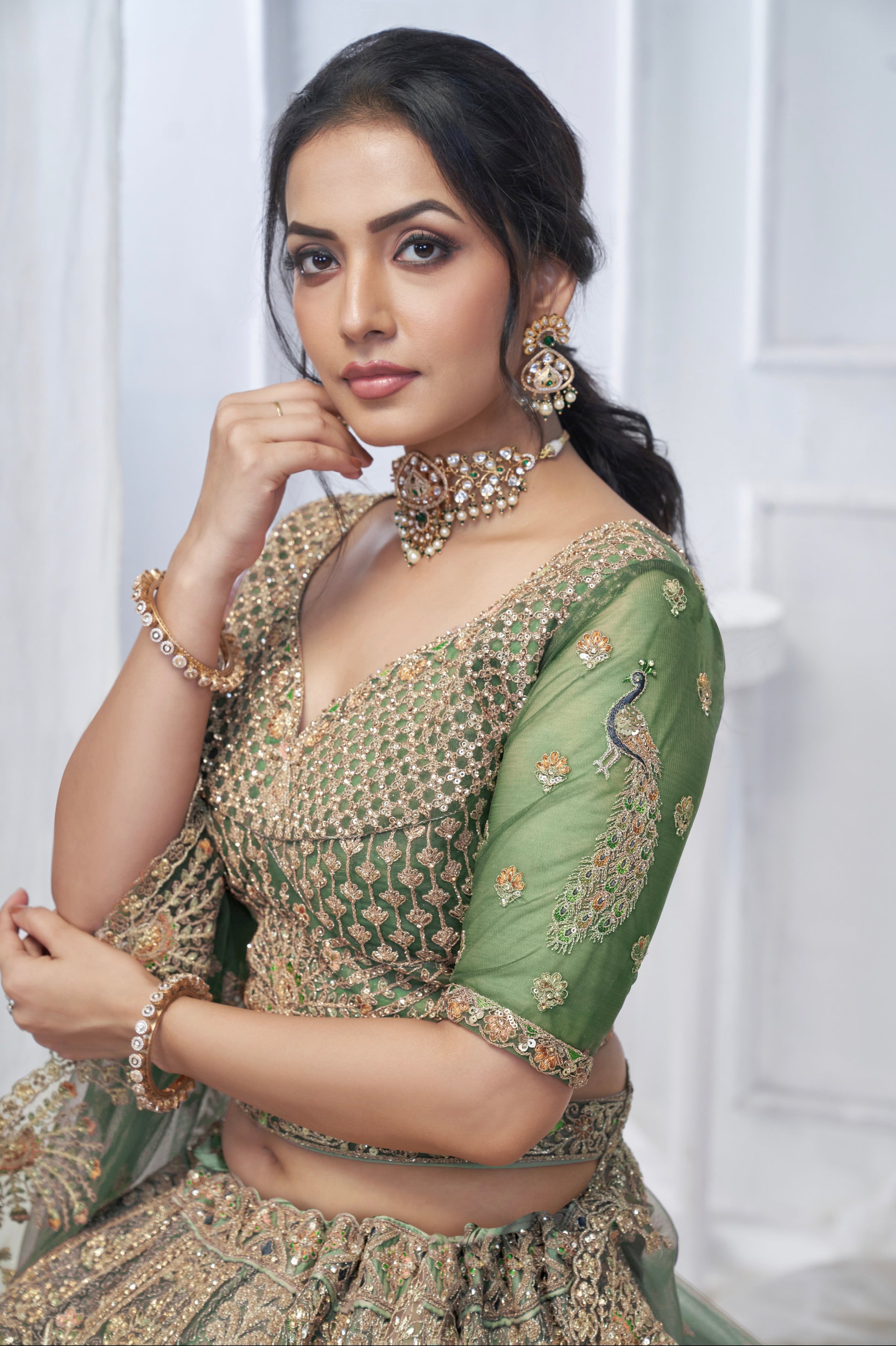 Green Soft Net Lehenga with Paisley & Peacock Embroidery