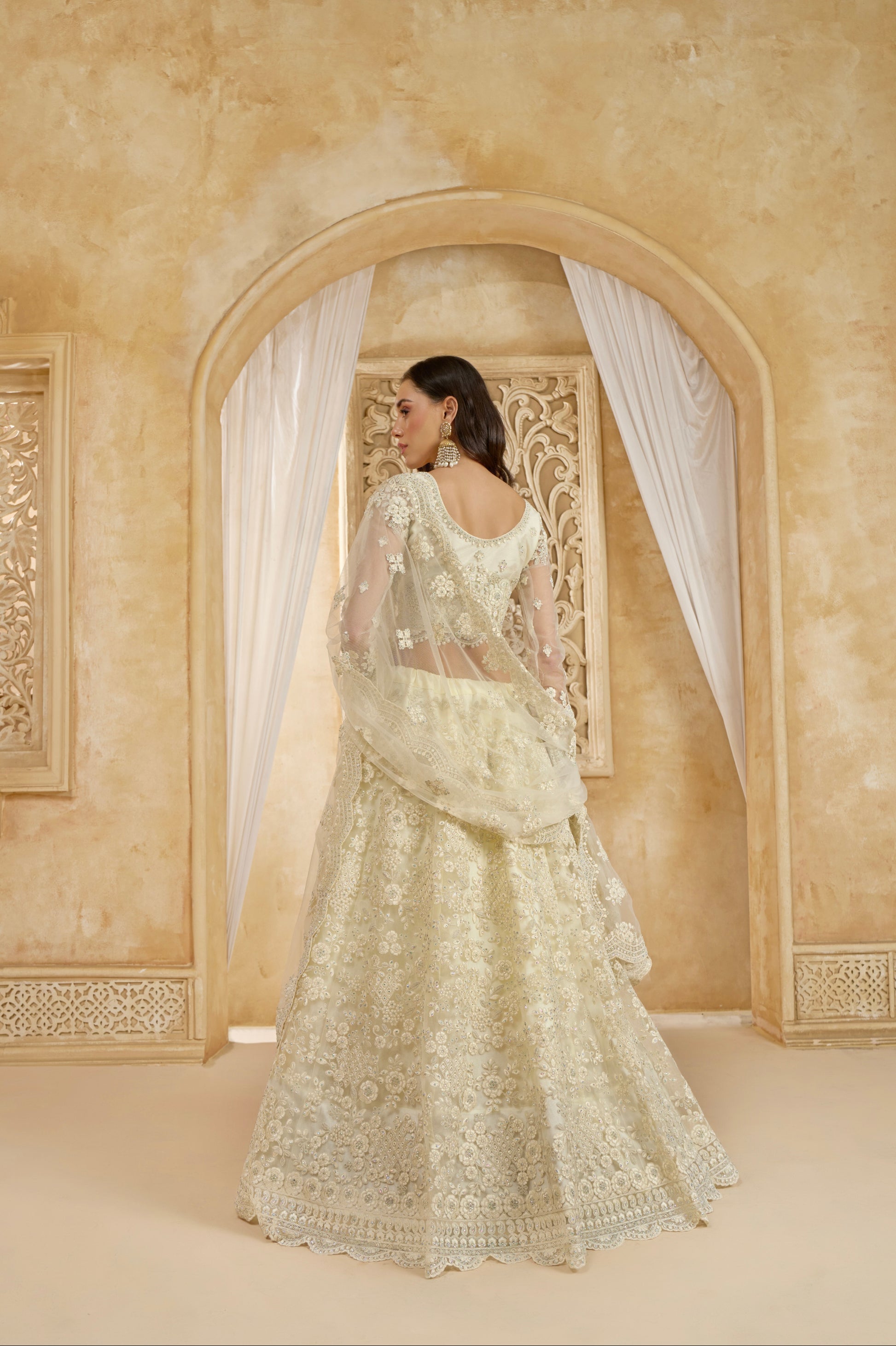 Ivory Net Embroidered Lehenga Choli with Stonework