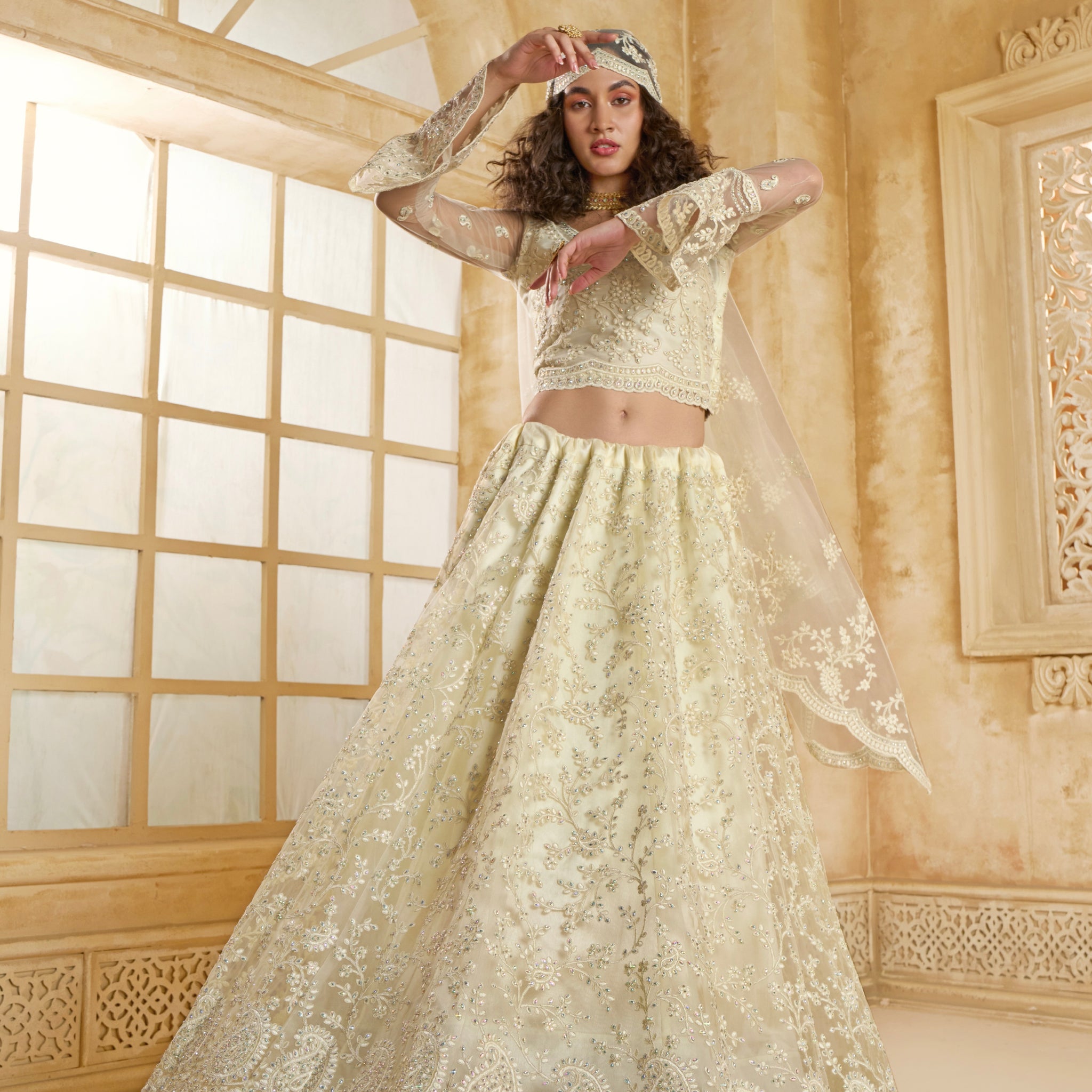 Ivory Net Bridal Lehenga Choli with All-Over Stone & Thread Embroidery