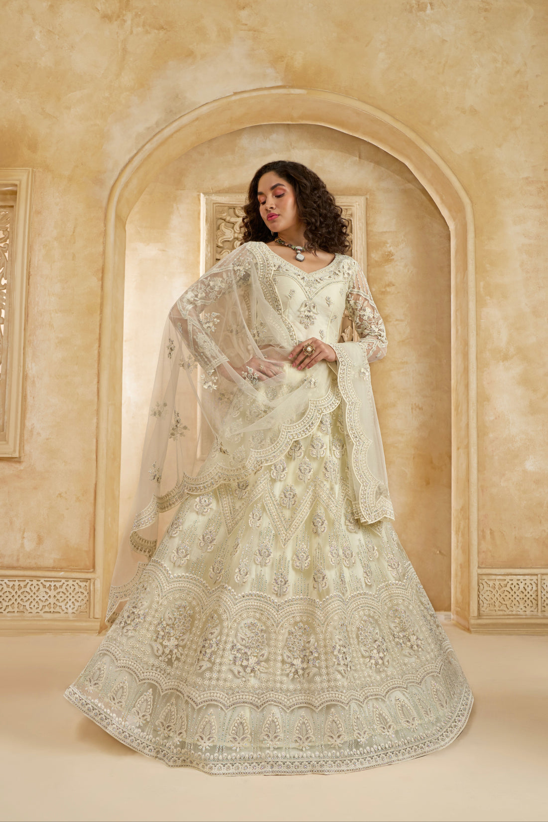 Ivory Net Lehenga Choli with Heavy Embroidery & Stonework