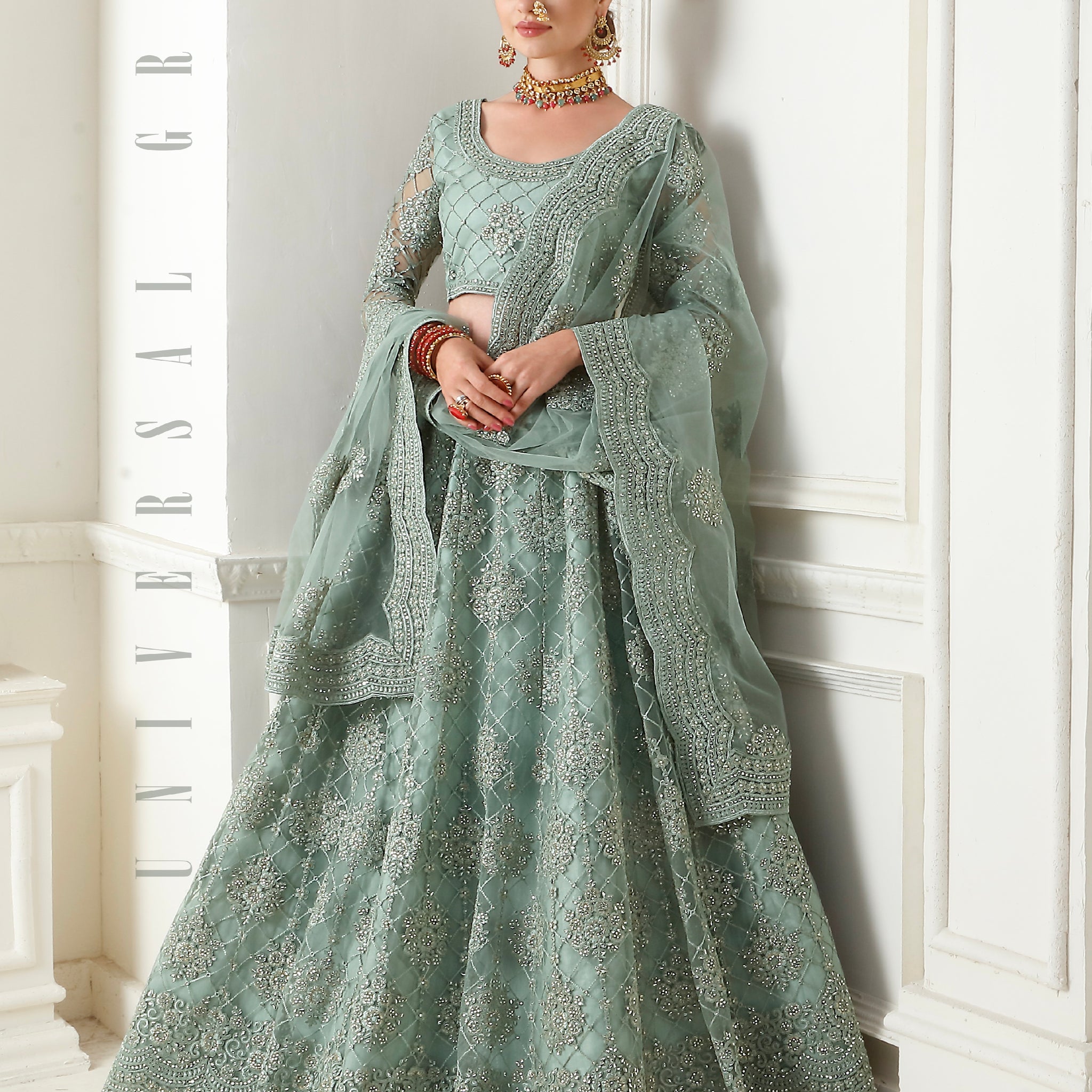 Mint Green Net Lehenga with Elegant Threadwork & Stone Embellishments