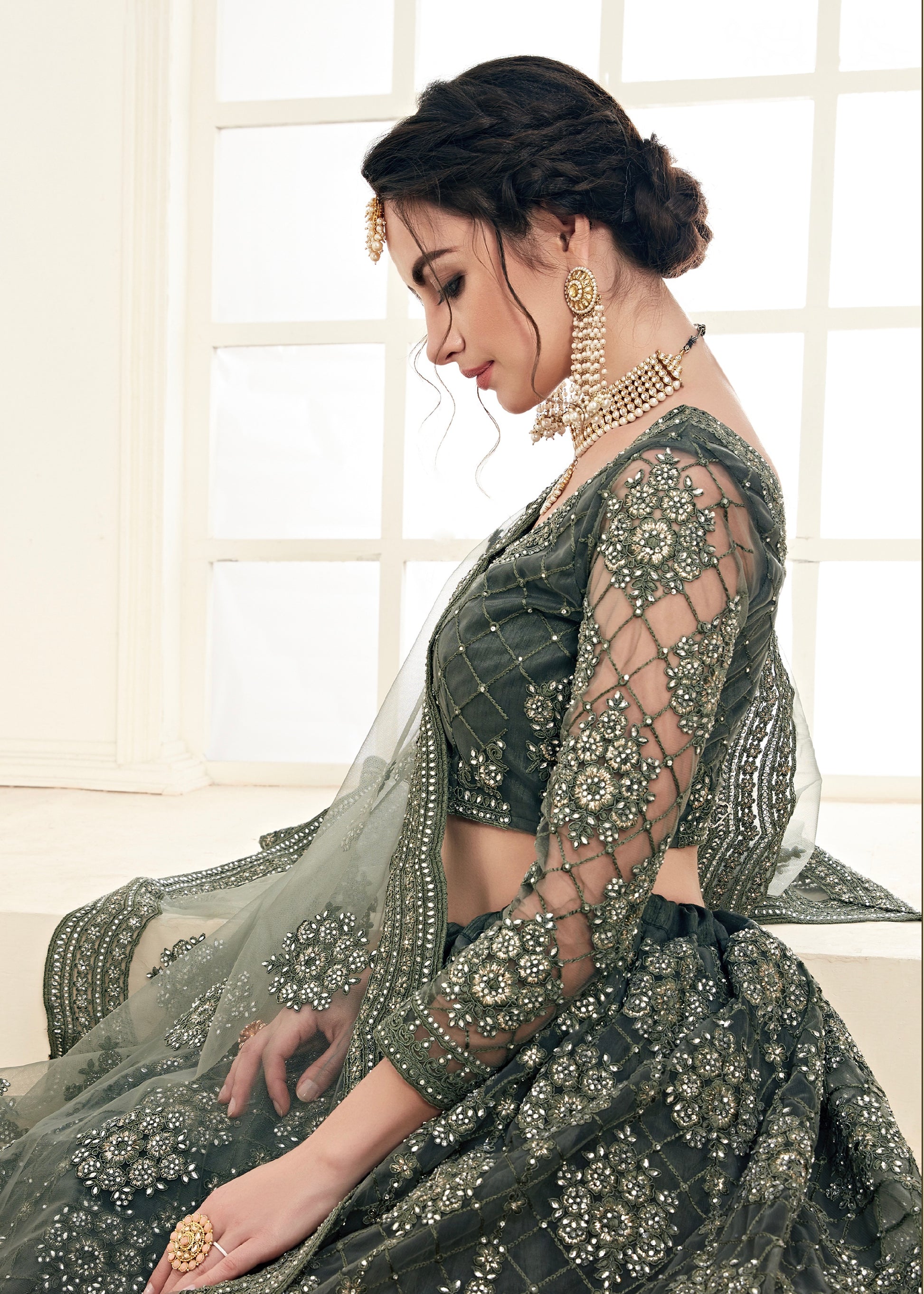 Green Net Lehenga with Heavy Threadwork and Stone Embellishments