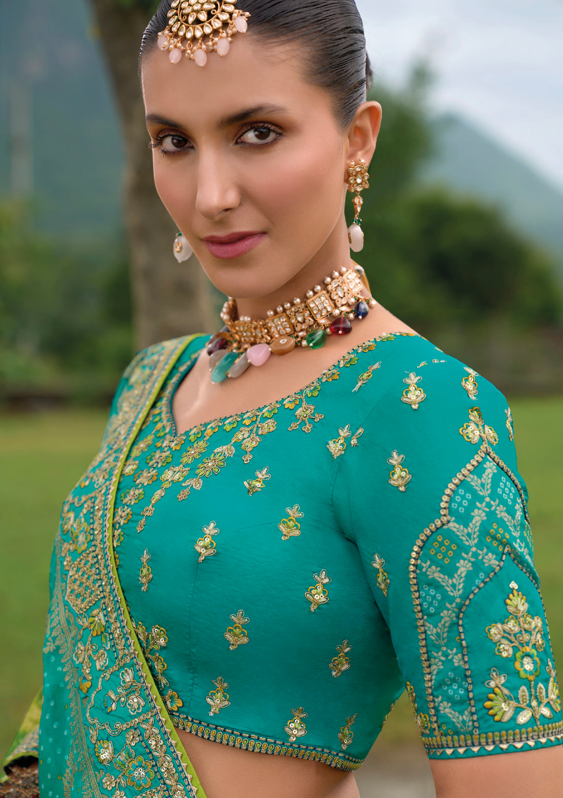 Turquoise Green Silk Lehenga with Heavily Embroidered Panels