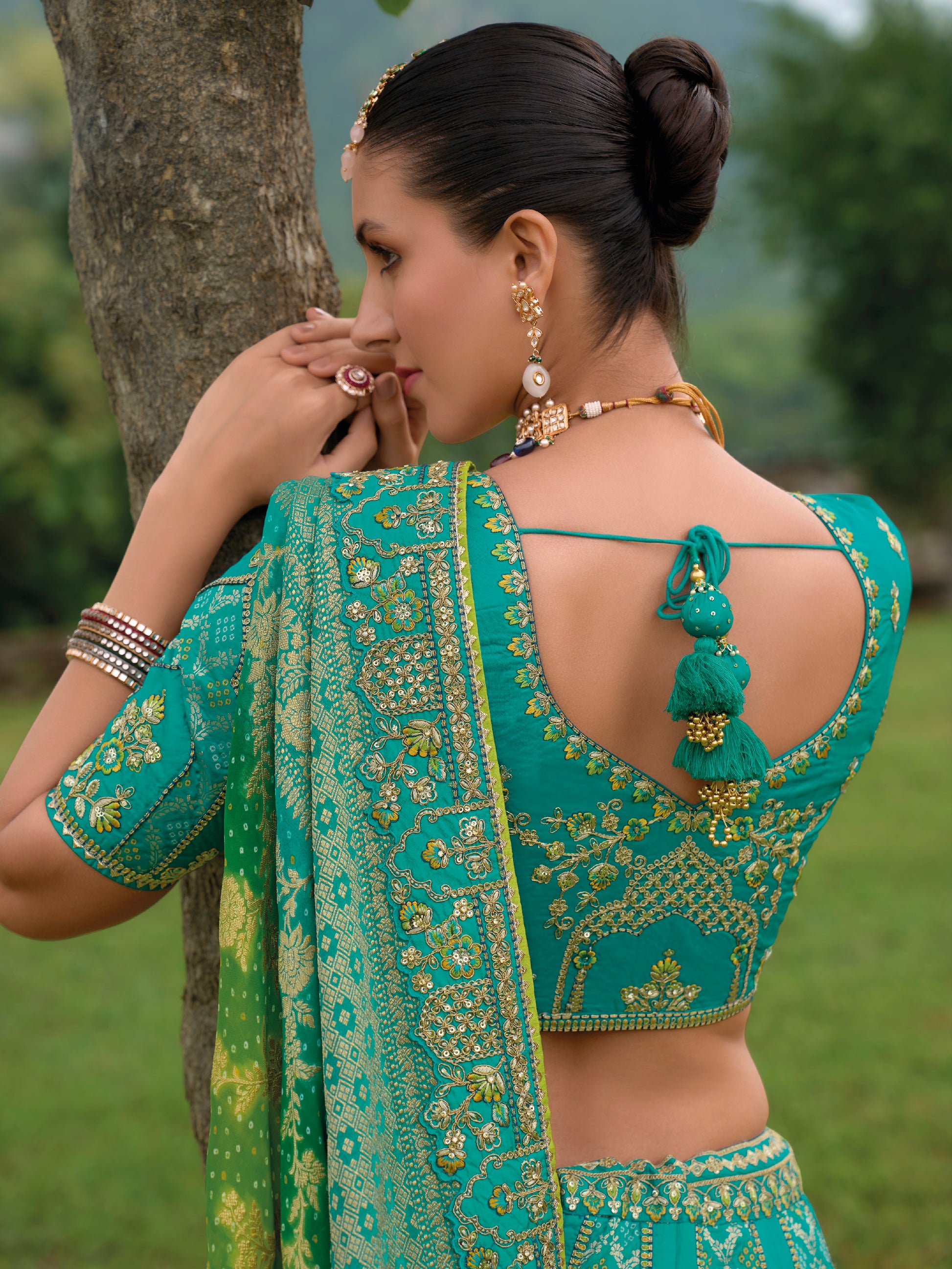 Turquoise Green Silk Lehenga with Heavily Embroidered Panels