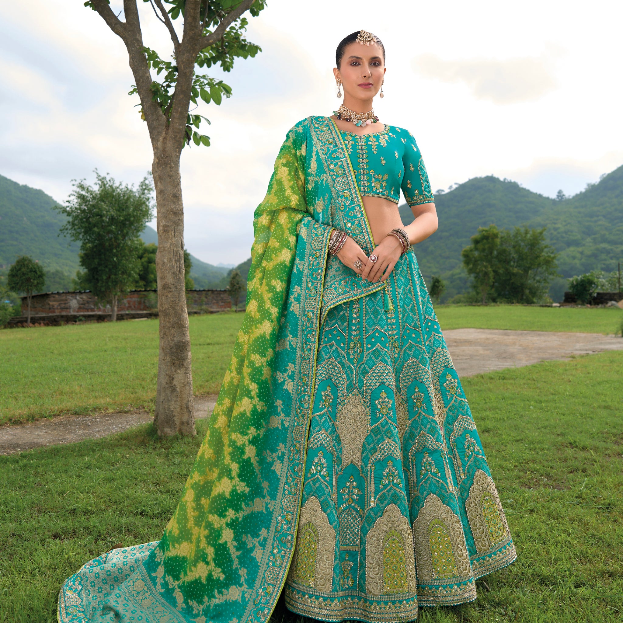 Turquoise Green Silk Lehenga with Heavily Embroidered Panels