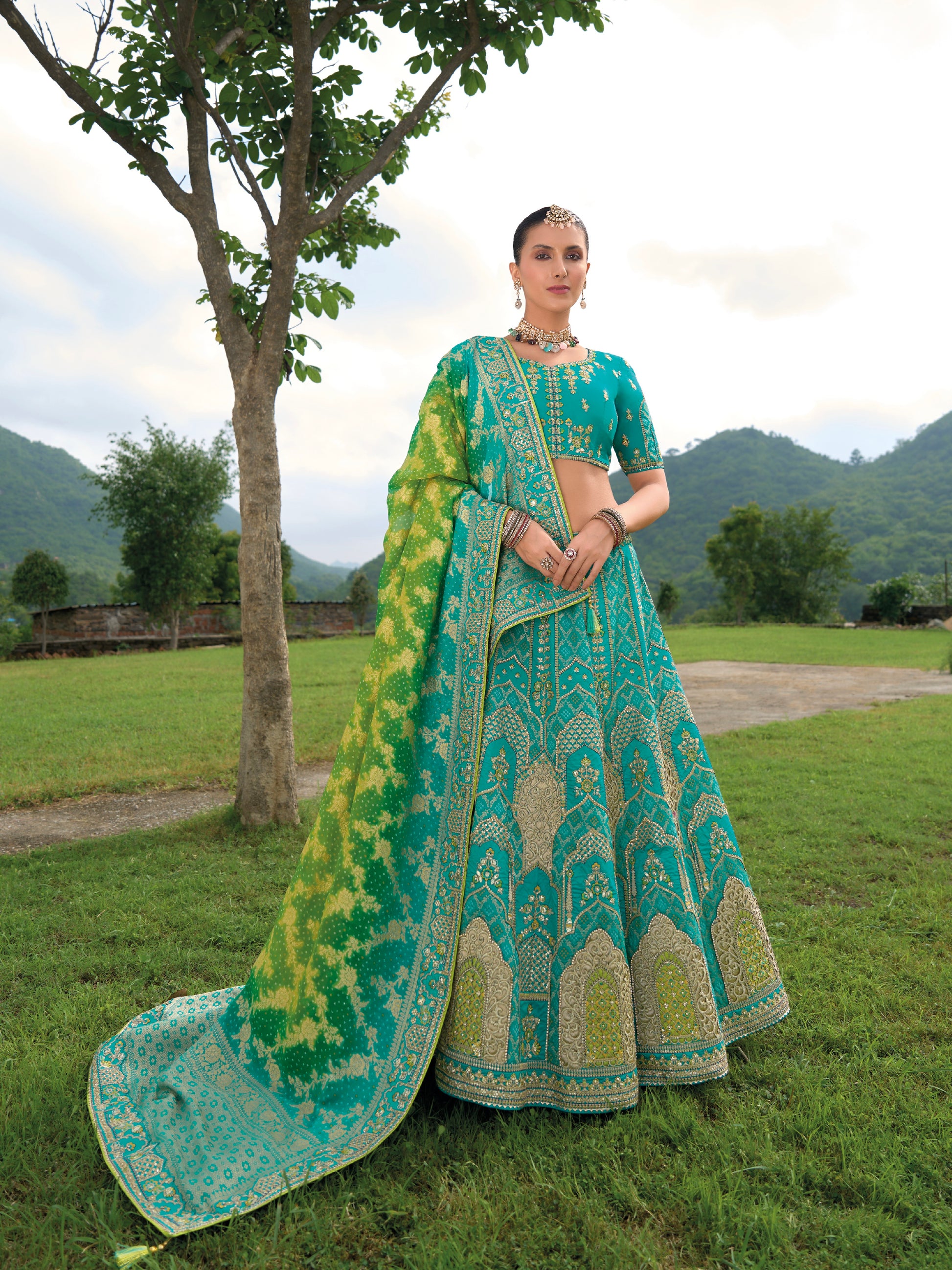 Turquoise Green Silk Lehenga with Heavily Embroidered Panels