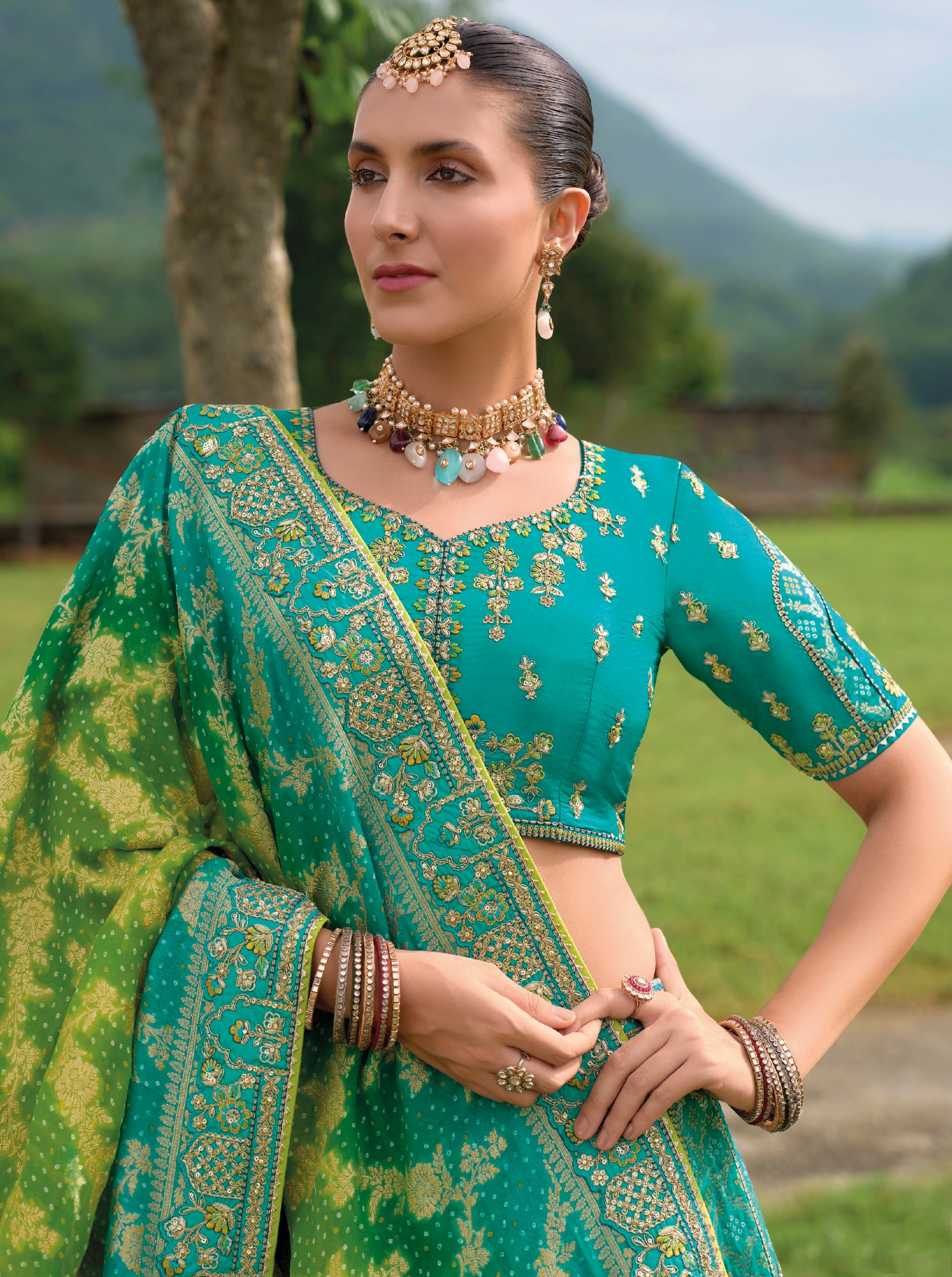 Turquoise Green Silk Lehenga with Heavily Embroidered Panels