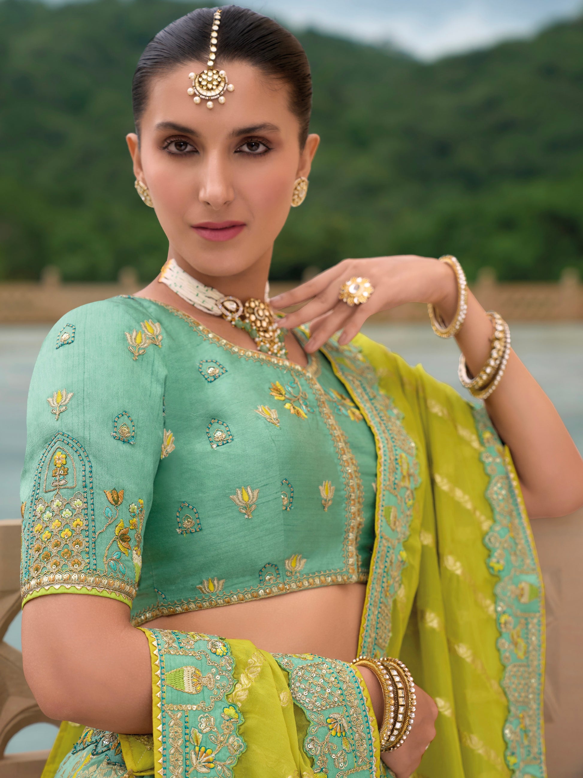 Mint Green and Yellow Silk Lehenga with Intricate Embroidery