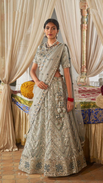 Seafoam green embellished lehenga with intricate detailing.