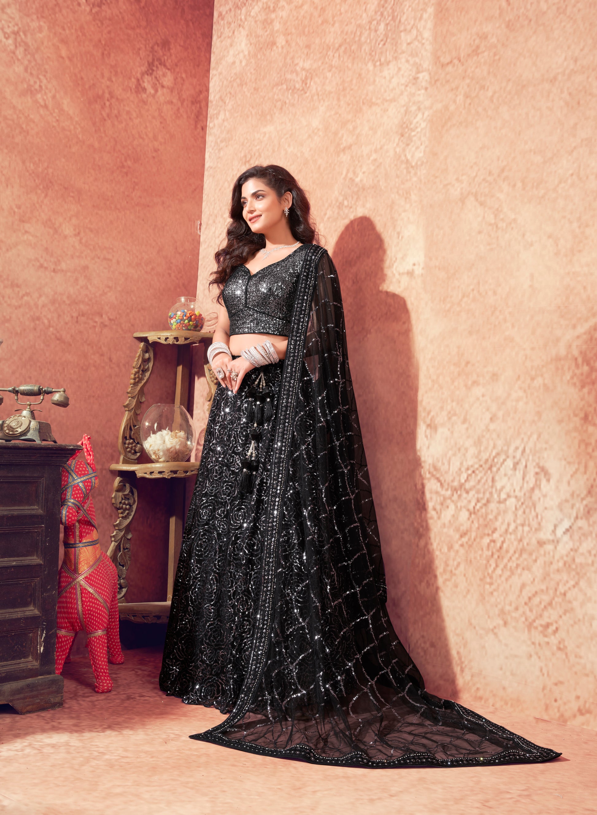 Blossom Black Net Lehenga Choli with Heavy Sequins Embellishments