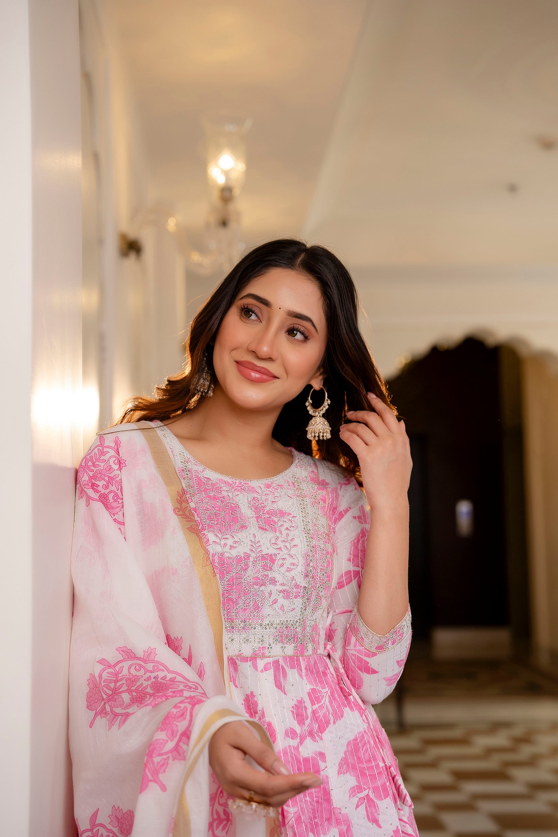 Woman wearing Pink and White Printed Viscose Rayon Kurti, Pant, and Dupatta Set

