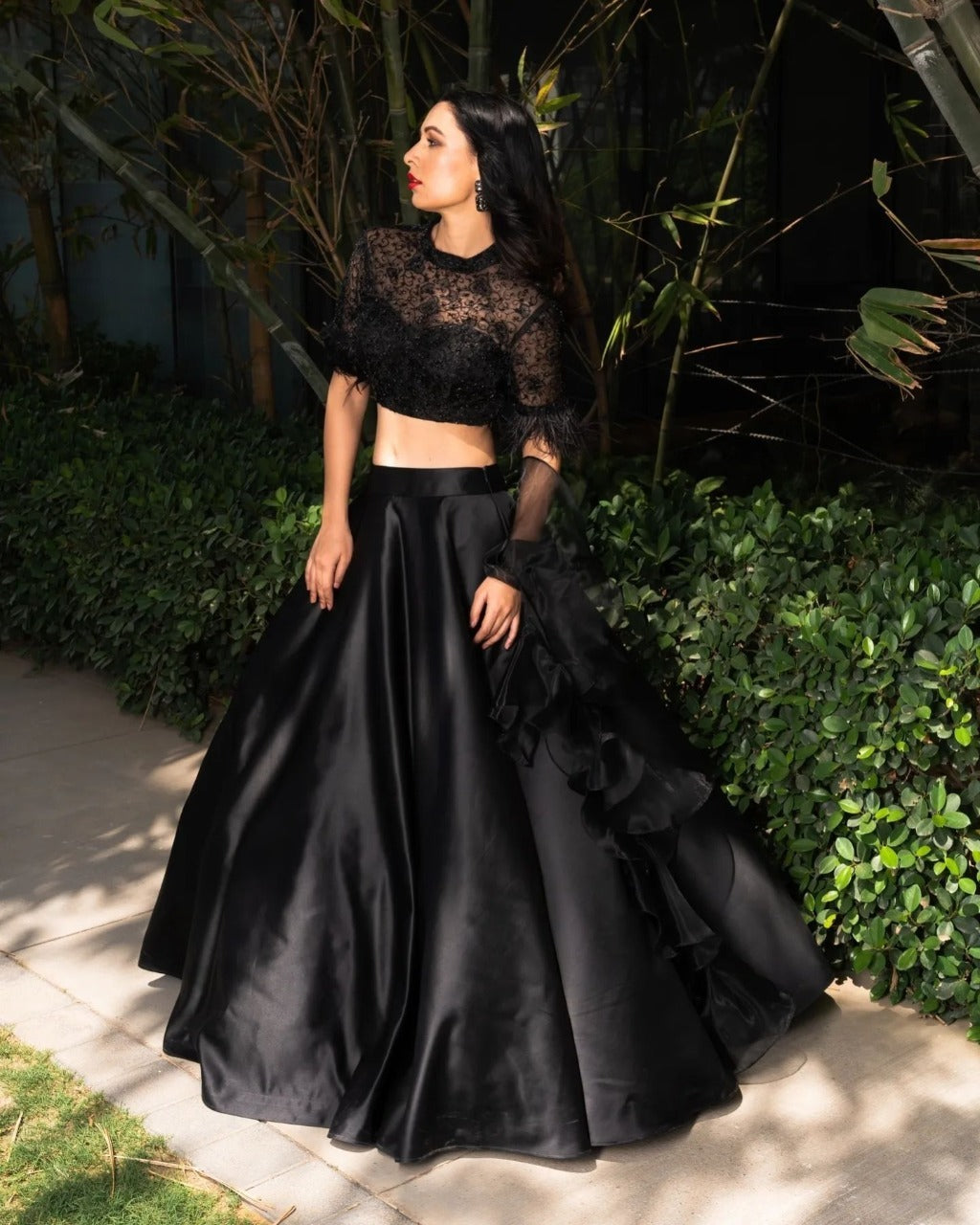 black color organza dupatta with a satin lehenga Anant Tex Exports Private Limited